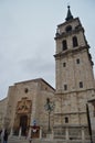 Main Facade Of The Cathedral On A Rainy Day In Alcala De Henares. January 1, 2014. Alcala De Henares, Madrid, Spain. Street