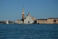 Main Facade Of The Church Of San Giorgio Maggiore And Its Spectacular Bell Tower With A Vaporeto Crossing Through In Venice.