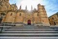 Main facade of the new cathedral of Salamanca with sun flare behind the monument, Spain. Royalty Free Stock Photo