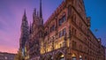 Main facade of the New Town Hall building at the northern part of Marienplatz day to night timelapse in Munich, Germany. Royalty Free Stock Photo