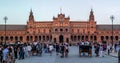 Main facade of plaza Spain and crowd of tourists in the foreground in Seville city