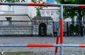 Main gate of the Russian Embassy in Berlin with red and white barricades in front, reflecting heightened security measures. Royalty Free Stock Photo