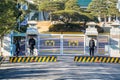 Main gate with security guard on duty at the the Blue House, Chewongde, the executive office and official residence of the Royalty Free Stock Photo