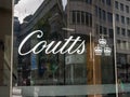 The main glass door entrance sign. Coutts and Co bank.