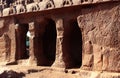 Main hall textured pillars sculpures and wall in mahabalipuram- five rathas