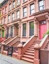 Main ladder and entry door. New york Harlem buildings. Brown houses. NYC, USA Royalty Free Stock Photo