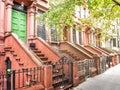 Main ladder and entry door. New york Harlem buildings. Brown houses. NYC, USA Royalty Free Stock Photo