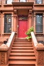 Main ladder and entry door. New york Harlem buildings. Brown houses. NYC, USA Royalty Free Stock Photo