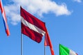 The main Latvia flag waving on sky blue background