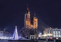 Main market square in Krakow with St. Mary`s Basilica before Christmas at night Royalty Free Stock Photo