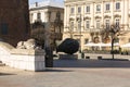 Main Market Square, stone sculptures of a lions in front of the entrance of Town Hall Tower, Krakow, Poland