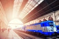 The main metro station Keleti with blue train and passengers. Budapest ,Hungary