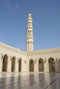 Main minaret and marble courtyard of Sultan Qaboos Mosque Royalty Free Stock Photo