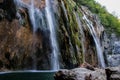 The main natural landmark of Croatia is the Plitvice Lakes with cascades of waterfalls. Emerald clear cold water on the background