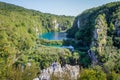 The main natural landmark of Croatia is the Plitvice Lakes with cascades of waterfalls. Emerald clear cold water on the background