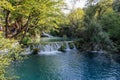 The main natural landmark of Croatia is the Plitvice Lakes with cascades of waterfalls. Emerald clear cold water on the background