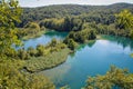 The main natural landmark of Croatia is the Plitvice Lakes with cascades of waterfalls. Emerald clear cold water on the background