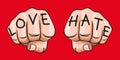 Concept of the expression of contrary feelings, with the words hate and love inscribed on two fists.