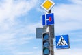 Main Road sign and a No Turn Allowed sign near sidewalk and traffic light Royalty Free Stock Photo