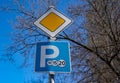 The main road sign and the parking sign on the same pole . Royalty Free Stock Photo