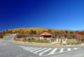 Main road and small cottage with autumn colors