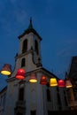 Main square with beautiful city lights in Szentendre Hungary next to Budapest with colorful banner light decorations and Royalty Free Stock Photo