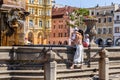 Main square in Ceske Budejovice, woman and chil near fountain. Czech republic, Europa