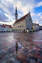 Main square with medieval buildings and reflections on the ground from the rain. Tallinn Estonia. Royalty Free Stock Photo