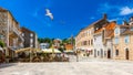 Main square in old medieval town Hvar with seagull`s flying over. Hvar is one of most popular tourist destinations in Croatia in Royalty Free Stock Photo