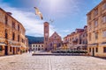 Main square in old medieval town Hvar with seagull`s flying over. Hvar is one of most popular tourist destinations in Croatia in