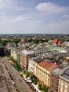 The main square of the Old Town of KrakÃÂ³w with picturesque colorful tenements and crowds of tourists. Poland, Krakow