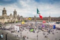 Main square Zocalo with cathedral, National Palace and big Mexican flag in the middle