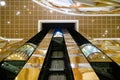 Main staircase in lobby of luxury hotel, golden  expensive luxury resort. Golden design of the hotel with beautiful lamps and Royalty Free Stock Photo