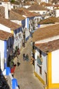 Main street flanked by typical whitewashed houses. Obidos. Portugal Royalty Free Stock Photo