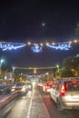 Main street of Haifa at night . Cars moving . Soon Ne YeaR !