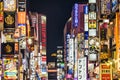 main street of Kabukicho with illuminated neon lights at night in Tokyo, Japan