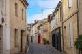 Main street of the medieval city of Saint Emilion. Wine shops can be seen on the sides. Royalty Free Stock Photo