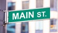 Main Street Sign, City Center Downtown, Green Color, Blur Buildings Background