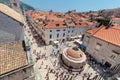 Main street Stradun full of tourists near church of St. Saviour and Big Onofrio`s fountain Royalty Free Stock Photo