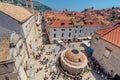 Main street Stradun full of tourists near church of St. Saviour and Big Onofrio`s fountain Royalty Free Stock Photo