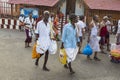 In the main street, Unidentified Hindu pilgrims people ready to go to the temple by walking, after the bath at the gate. Great tim