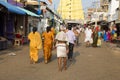 In the main street, Unidentified Hindu pilgrims people ready to go to the temple by walking, after the bath at the gate. Great tim
