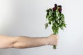 Marridge problems, man hold old dead flowers couples divorce depression rose