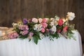 Main table at a wedding reception with beautiful flowers. Wedding decoations with pink flowers.