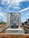 Main tank power transformer Installation on the foundation on clouds in the blue sky background