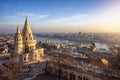 The main tower of the Fisherman`s Bastion from above with Hungarian Parliament building and River Danube Royalty Free Stock Photo