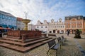 Main town Charles` square with baroque fountain, historic houses with stucco, Christmas decorations in Kolin, Central Bohemia,
