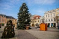 Main town Charles` square with baroque fountain, historic houses with stucco, Christmas tree and Christmas decorations in Kolin,