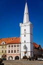 Main town Peace square, gothic white city hall tower, House at the golden sun, Medieval street, renaissance historical buildings, Royalty Free Stock Photo