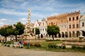 Main town square Zachariase z Hradce with renaissance and baroque colorful historical buildings and Marian Column, Romantic houses